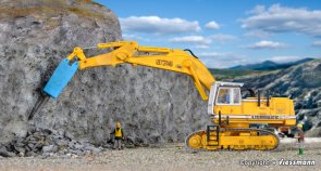 LIEBHERR 974 with demolition chisel and protective cage.